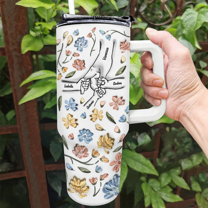 Personalized 40oz Tumbler with Hand In Hand design, floral pattern, and straw, a perfect gift for Mom and Grandma.