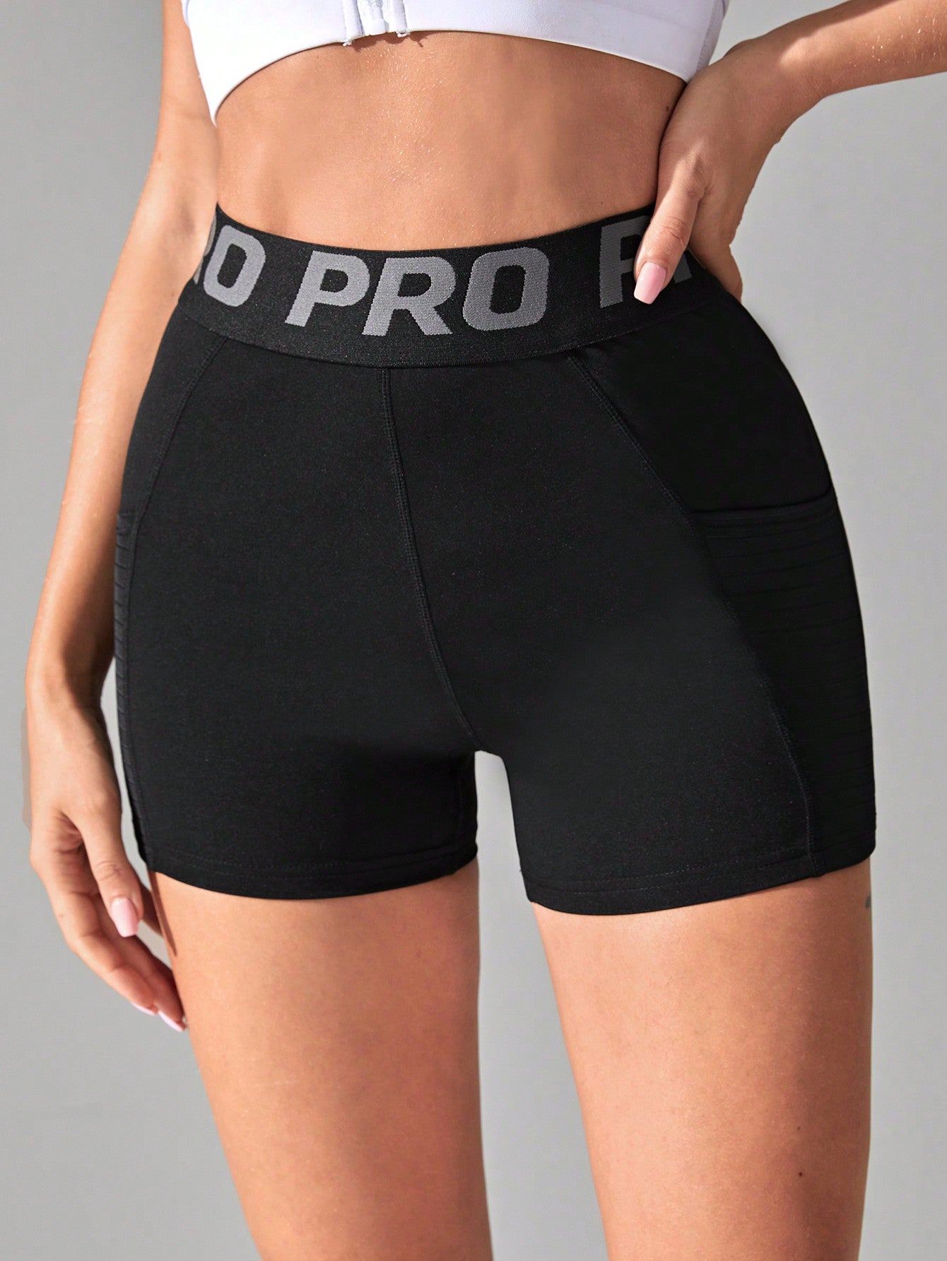 Yoga Basic Letter Tape Waist Sports Shorts With Phone Pocket