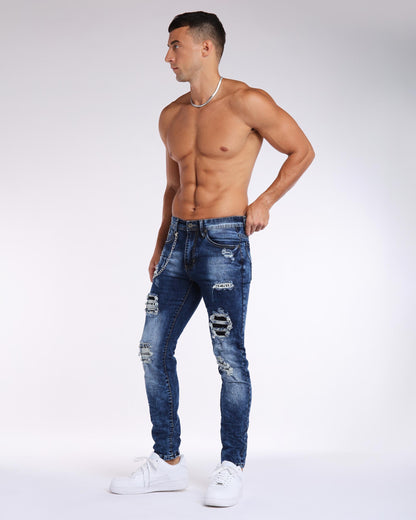 Dunkel verwaschene Slim Fit-Jeans in Blau mit Rissen