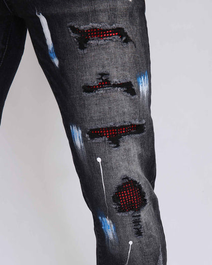 Street Art Chic zerrissene schwarze Jeans mit Graffiti-Farbzeichnung 