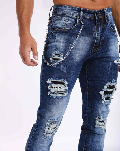 Dunkel verwaschene Slim Fit-Jeans in Blau mit Rissen