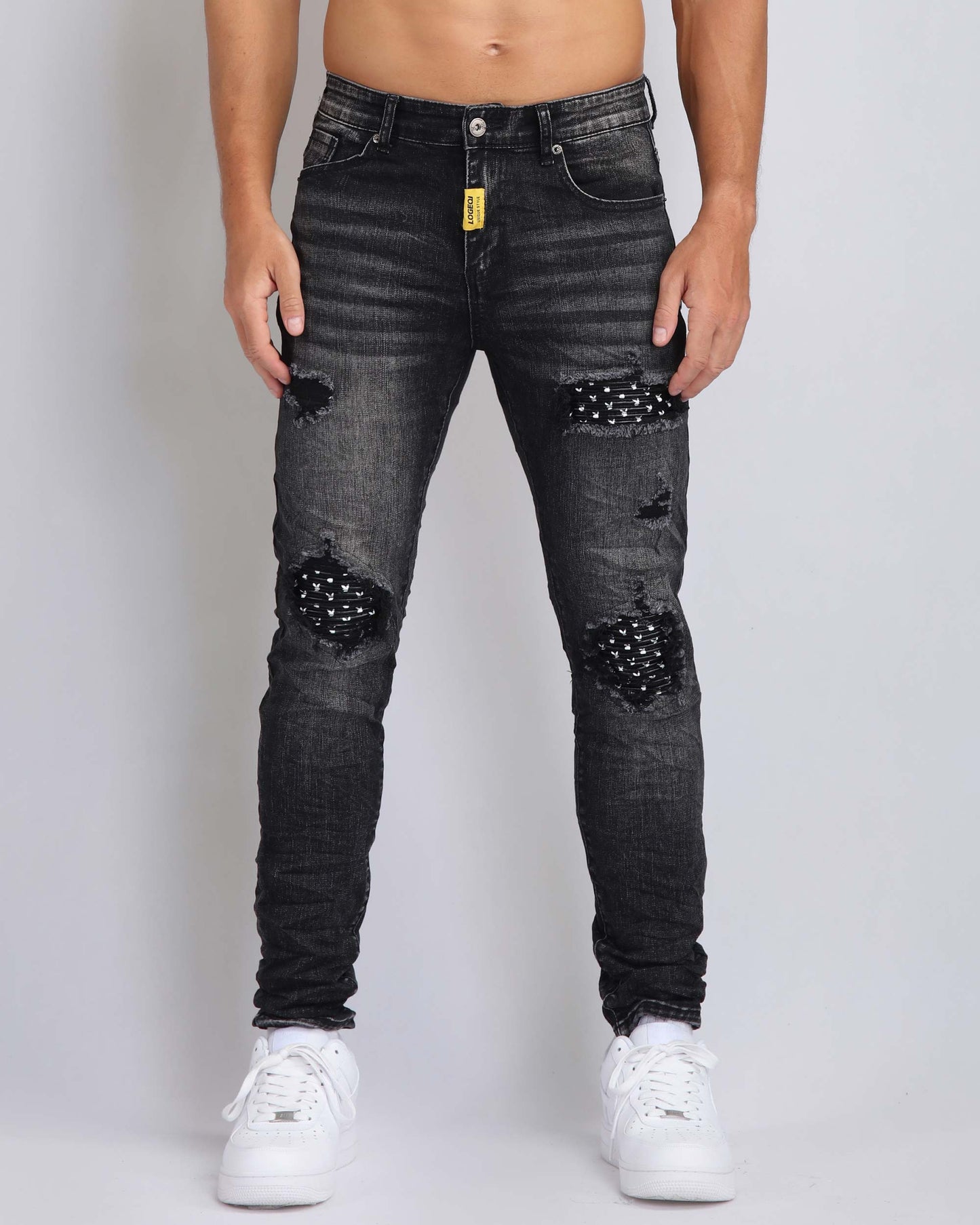 Black Ripped Jeans with Striking Black Patches